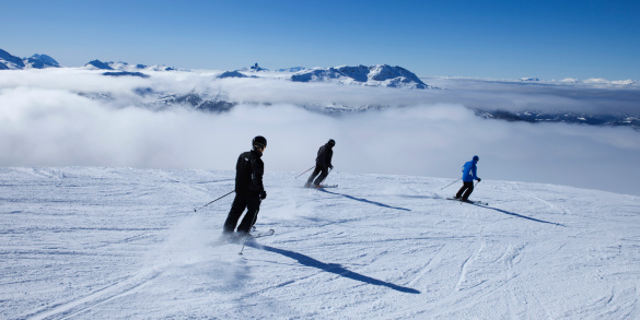 three guys skiing on beautiful sunny day.Please view more winter images in my