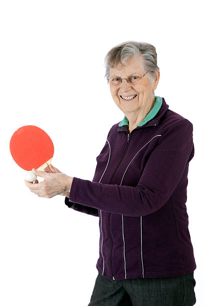 Active Senior Playing Ping Pong stock photo