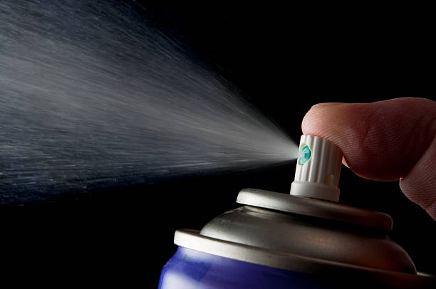 istock Spraying aerosol can isolated in black 182389859