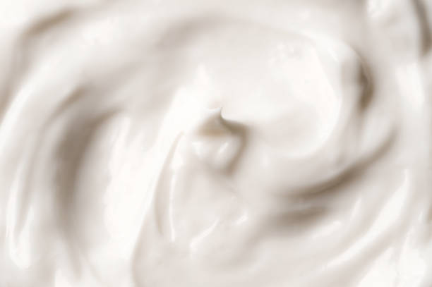 Close-up of white smooth rich facial cream closeup of white facial creme. moisturizing cream stock pictures, royalty-free photos & images