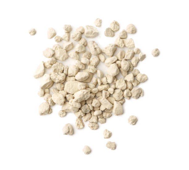 istock Mineral cat litter filler on white background 1823899530