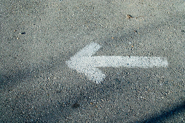 istock Arrow sign on road 182390722