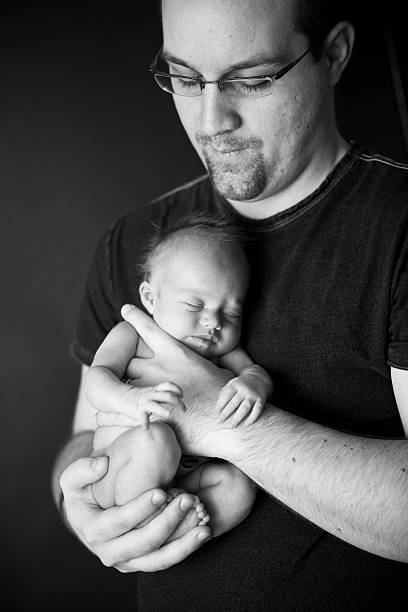 istock New Father Holding His Newborn Baby 182391508