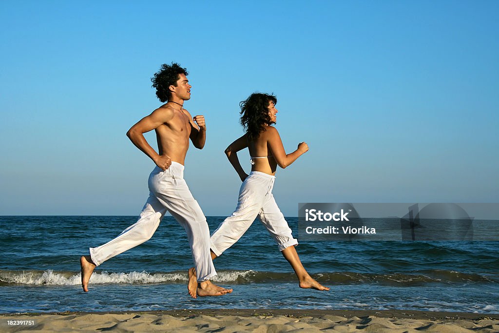 Corriendo en la playa - Foto de stock de Actividad libre de derechos