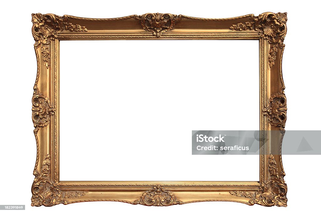 Empty gold ornate picture frame with white background Gold plated wooden picture frame. Other images in:  Picture Frame Stock Photo