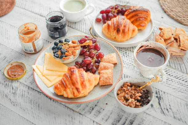 istock Breakfast: croissants, yogurt, fruit and coffee. 1823919110