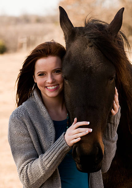 istock Girl with horse 182392155