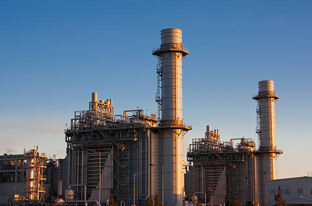 istock Gas fired turbine power plant with blue sky background 182392412