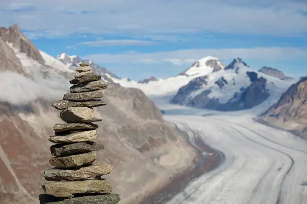 Stone cairn at the Aletsch glacier - Europe's largest glacier - in Switzerland.
