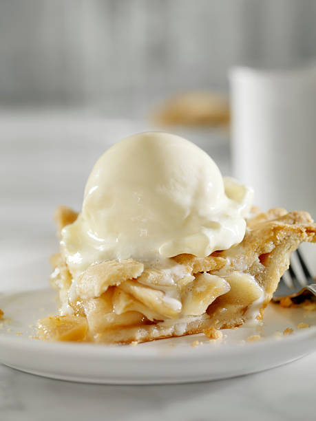 Apple Pie with Melting Vanilla Ice Cream Apple Pie with Melting Vanilla Ice Cream and Coffee -Photographed on Hasselblad H3D2-39mb Camera apple pie a la mode stock pictures, royalty-free photos & images