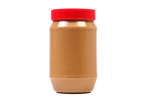 Horizontal image of peanut butter jar isolated on white.