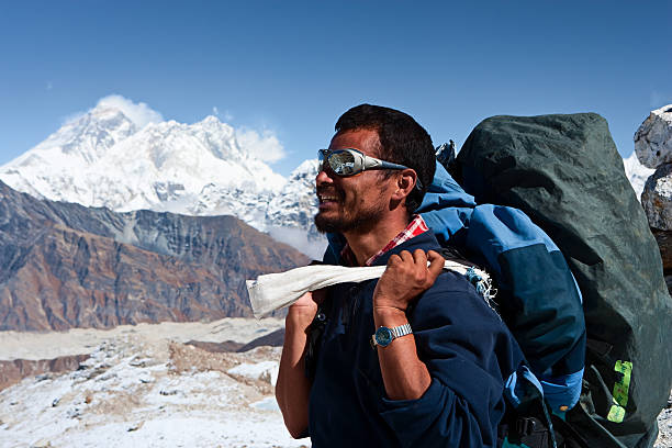 Nepali porter against a background of Mount Everest