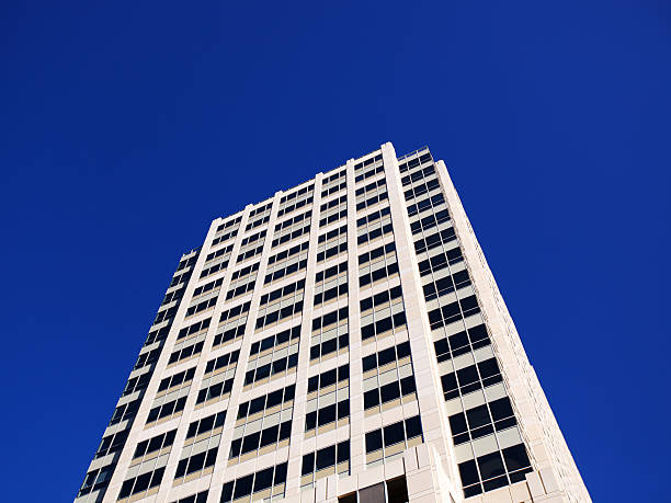 istock Modern office building isolated against sky 182393689