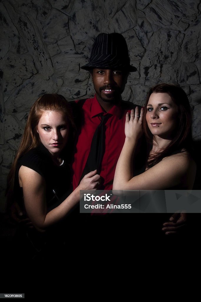 Nightlife: handsome african-american man with two beautiful women Nightlife: handsome african-american man with two beautiful women. You might also be interested in these: 20-24 Years Stock Photo