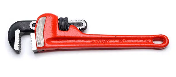 Photo of Pipe wrench with red handle on a white background