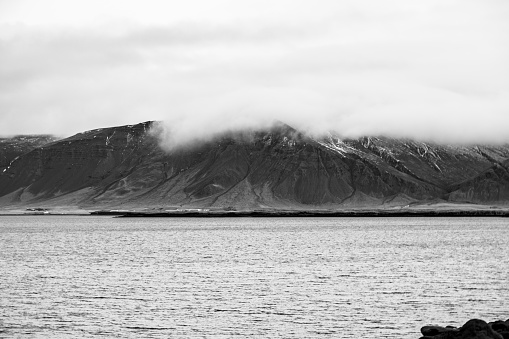 Looking across the bay of Reykjavik at the cloudy mountains