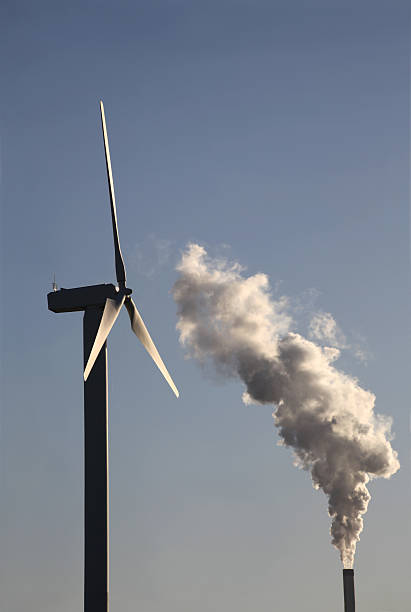 istock Wind turbine versus fossil power plant 182394037