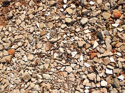 Pebbles on a beach background, natural texture of small pebbles stones