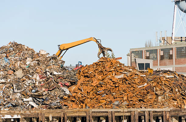istock Scrap metal recycler and crane with grab tool 182394336