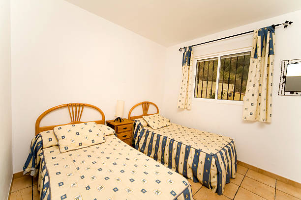 istock Hotel bedroom with twin single size beds 182394401