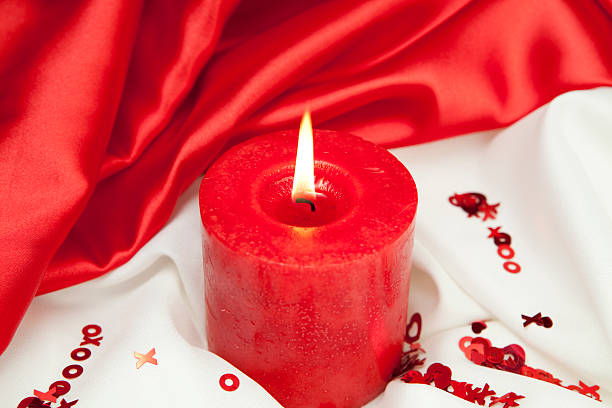Valentines Day Candle "Candle with satin,m X, O's and heartsCheck out my Love & Valentine's Series" flaming o symbol stock pictures, royalty-free photos & images