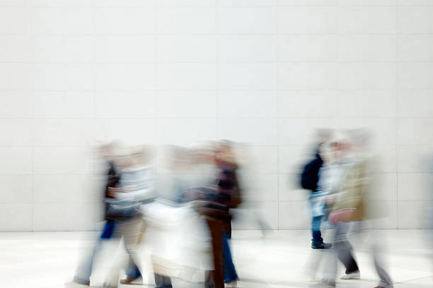 istock Group of people walking, motion blur 182395286
