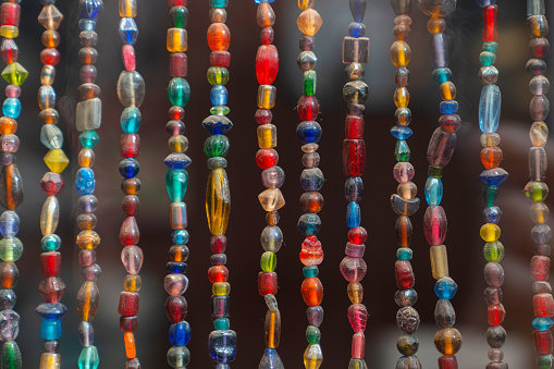 Old and dusty glass beads and ornaments of different colors