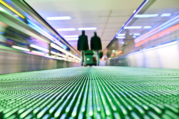 istock Silhouette of two Businessmans Travelling on Escalator 182396517