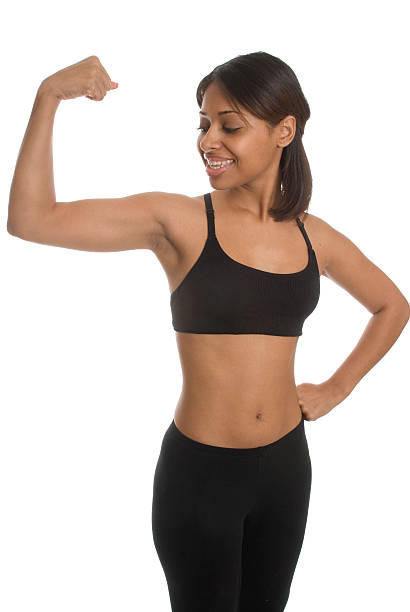 istock Young Woman Looking At Her Muscle 182396520
