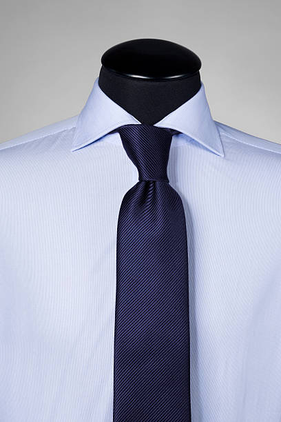 istock dark blue tie on striped shirt 182396872