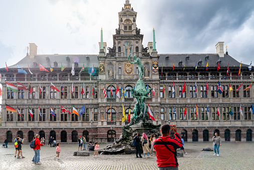Antwerp, Belgium - July 24 2023: Antwerp City Hall with tourist taking photo