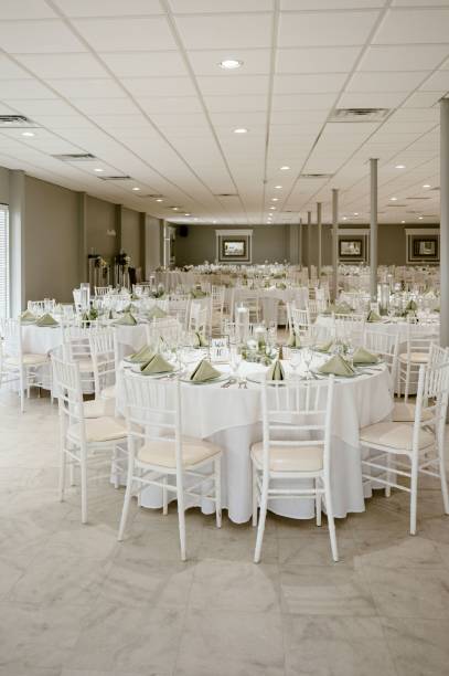 istock Elegant white table setting for a wedding reception with pristine plates and napkins 1823969946
