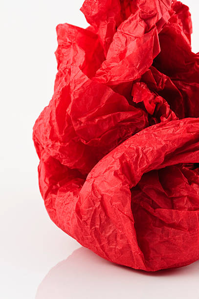 istock Tissue paper red scrunched isolated on white 182397094