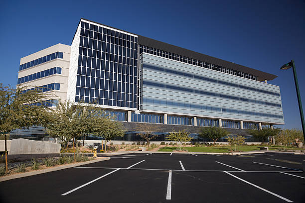 Scottsdale Angular Business Building Scottsdale Arizona angluar business building modern 20th century style on a clear day with acaicia trees set on a bright blue clear sky background southwest usa architecture building exterior scottsdale stock pictures, royalty-free photos & images