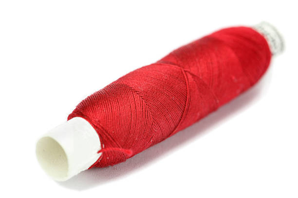 istock reel of red thread isolated on white 182397301