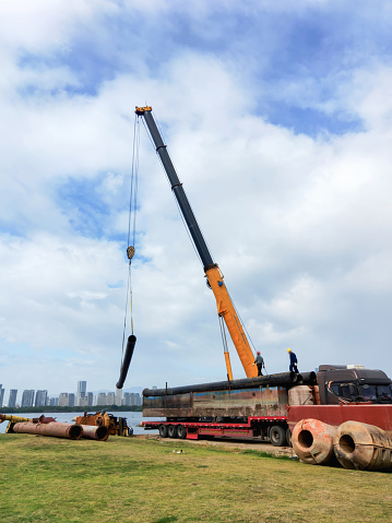 The dockers are working with the crane