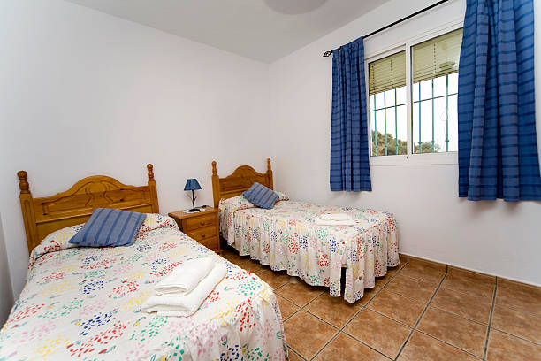 istock Hotel bedroom with twin single size beds 182397680
