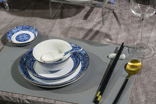 Chinese table setting：Spoon and chopsticks, empty plate.