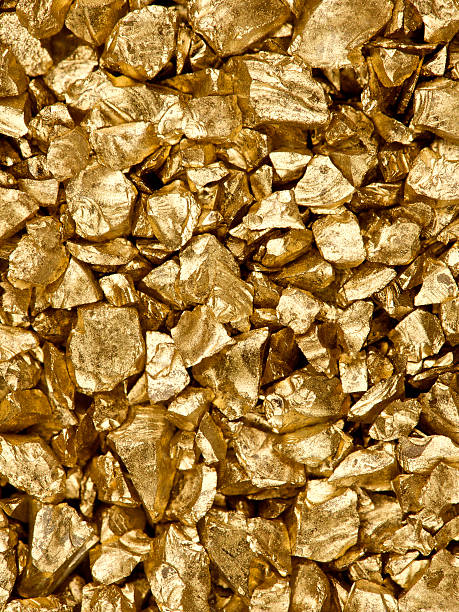 gold nuggets High resolution image of gold nuggets, studio lit for maximum detail. Also, a similar image with more nuggets: metal ore stock pictures, royalty-free photos & images