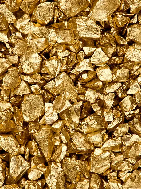 High resolution image of gold nuggets, studio lit for maximum detail. Also, a similar image with more nuggets: