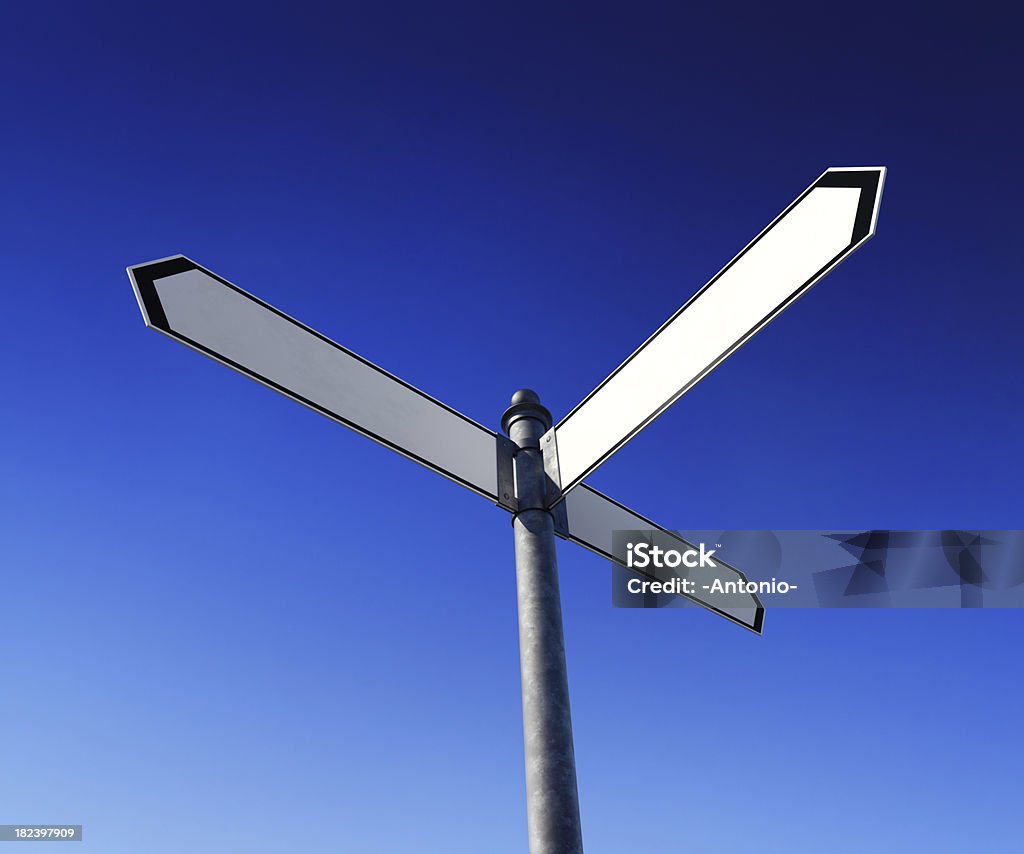 Blank signpost Low-angle view of blank signpost with 3 arrows - just add your text.Clipping path included for easy background change. Three Objects Stock Photo