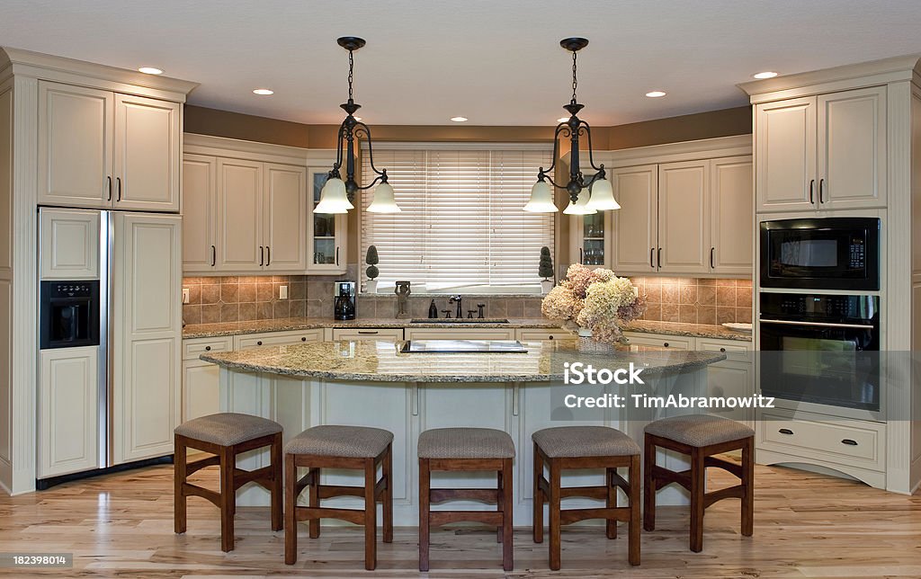 Custom Kitchen Beautiful custom kitchen with large island. Appliance Stock Photo