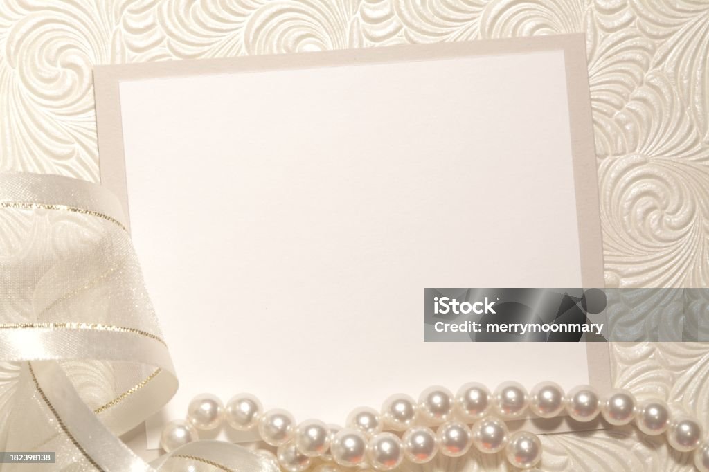 White Elegant Background XXXL photo of creamy paper with a light gray border on a pearlescent textured papaer with ribon and pearls. Invitation Stock Photo
