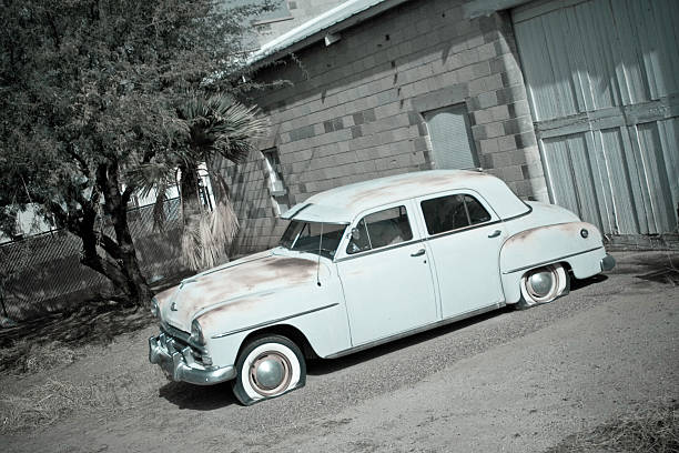 istock Old Car By An Older Garage 182398419