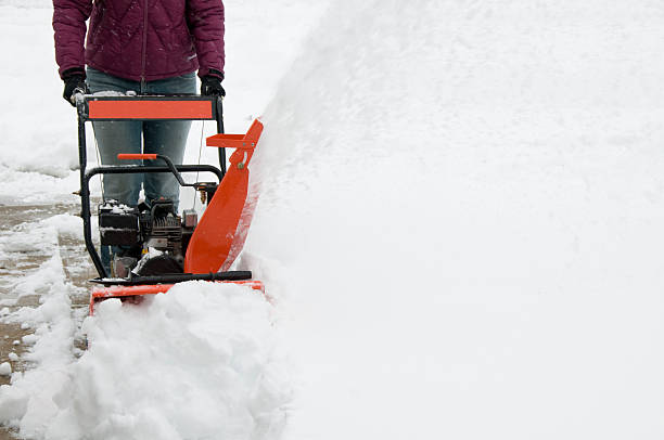 istock Woman Operating Snowblower 182398523