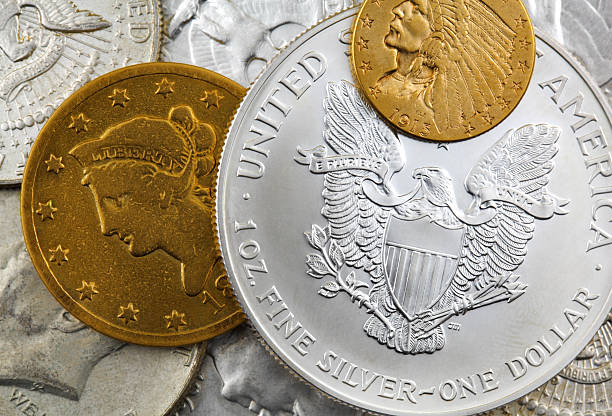 Silver and Gold Coins Silver and Gold coins. coin collection stock pictures, royalty-free photos & images