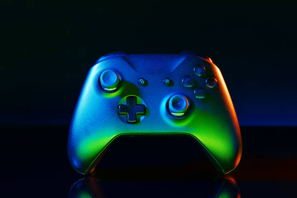 istock Gaming joystick on black background in neon light 1823988342
