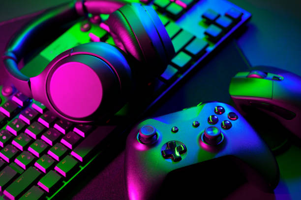 istock Headphones, joystick and computer keyboard on black table 1823988845