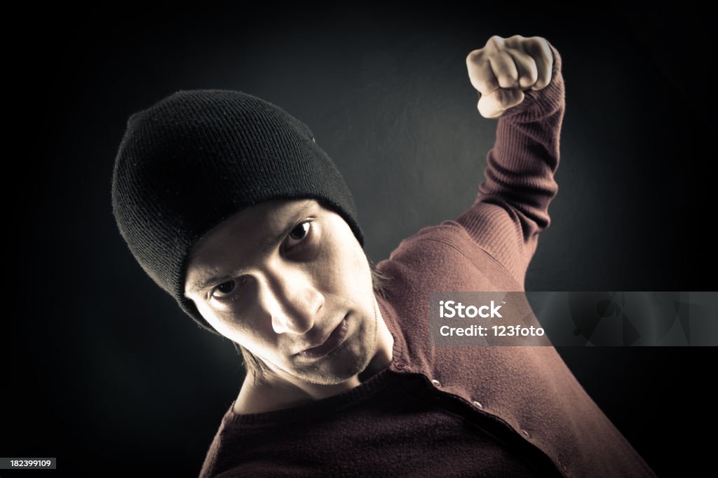 Colpire con un pugno - Foto stock royalty-free di Abbigliamento casual