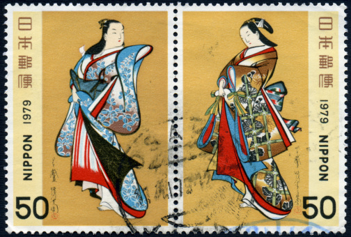 Attached pair of 50 yen Japanese postage stamps issued in 1979 depicting two beautiful standing traditionally dressed women from the Middle Edo Period.